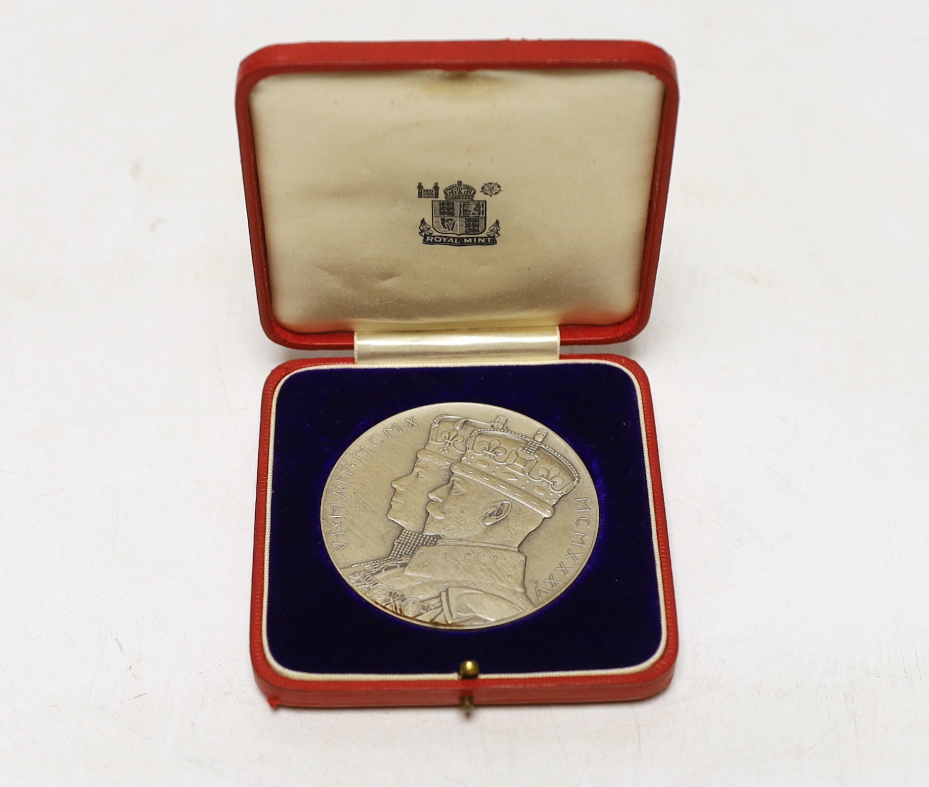 A George V and Queen Mary silver jubilee commemorative silver medal with case